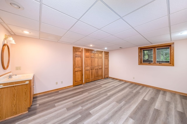 3075 Mineral Springs Trl, Mount Pleasant, MI 48858 - below grade area with light wood-style flooring, a paneled ceiling, and recessed lighting