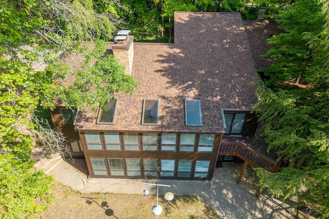 3075 Mineral Springs Trl, Mount Pleasant, MI 48858 - rear view of property with a chimney, a shingled roof, stairs, and a deck