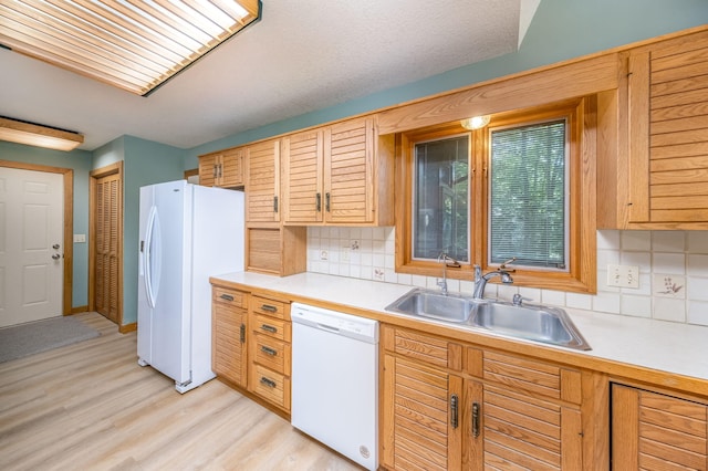 3075 Mineral Springs Trl, Mount Pleasant, MI 48858 - kitchen featuring white appliances, light countertops, and decorative backsplash