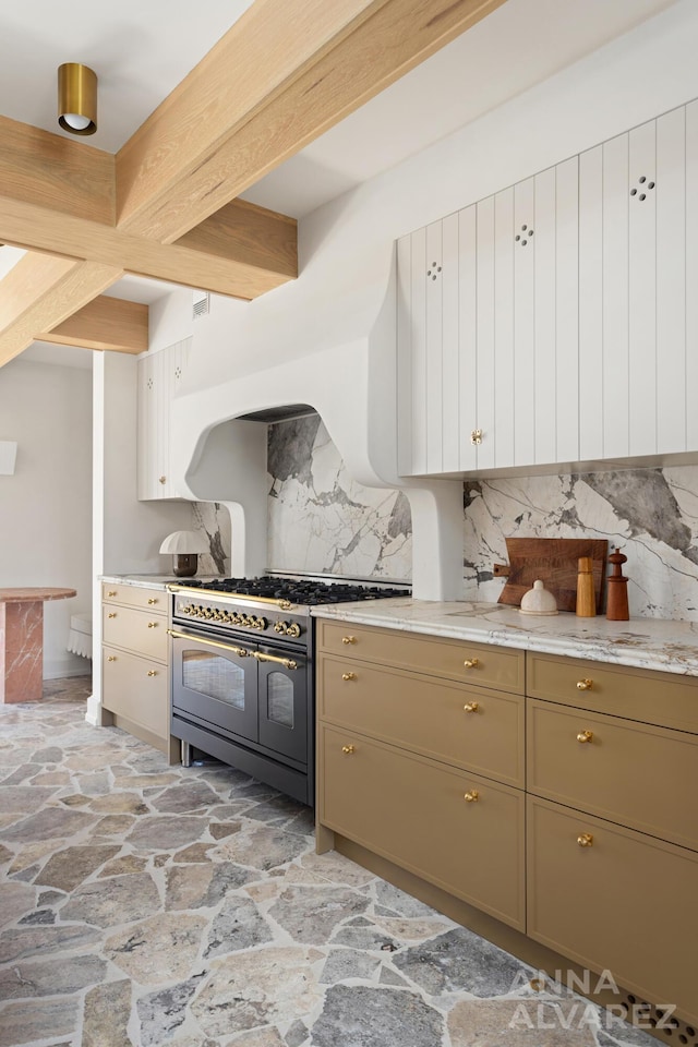 727 Plymouth Rd SE, East Grand Rapids, MI 49506 - kitchen with range with two ovens, stone flooring, decorative backsplash, and beamed ceiling