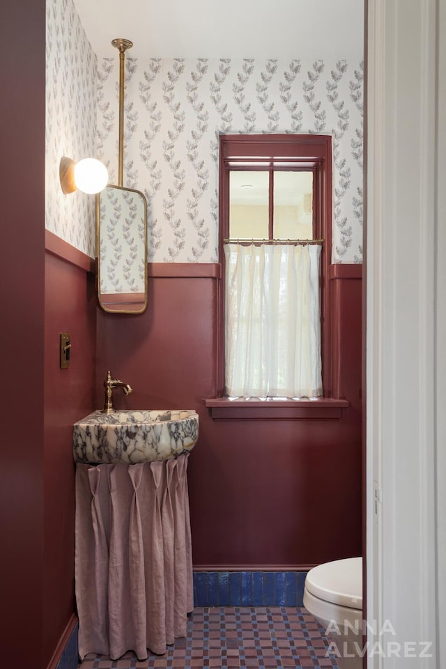 727 Plymouth Rd SE, East Grand Rapids, MI 49506 - bathroom featuring wallpapered walls and a wainscoted wall