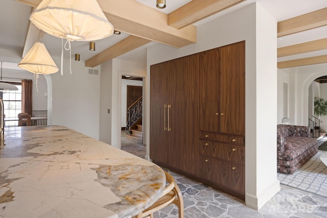 727 Plymouth Rd SE, East Grand Rapids, MI 49506 - bedroom featuring arched walkways and beam ceiling
