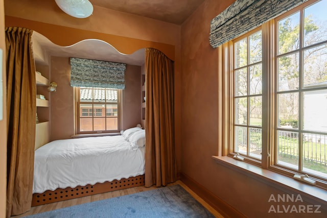 727 Plymouth Rd SE, East Grand Rapids, MI 49506 - bedroom featuring wood finished floors and baseboards