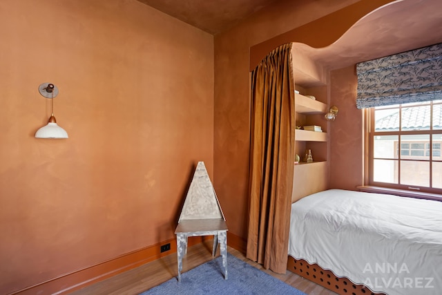 727 Plymouth Rd SE, East Grand Rapids, MI 49506 - bedroom with wood finished floors and baseboards
