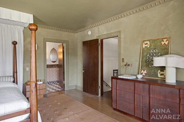 727 Plymouth Rd SE, East Grand Rapids, MI 49506 - bedroom featuring wood finished floors and ensuite bathroom