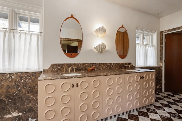 727 Plymouth Rd SE, East Grand Rapids, MI 49506 - bathroom featuring double vanity and backsplash