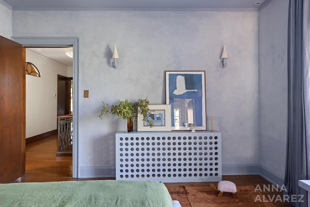 727 Plymouth Rd SE, East Grand Rapids, MI 49506 - bedroom with wood finished floors and ornamental molding