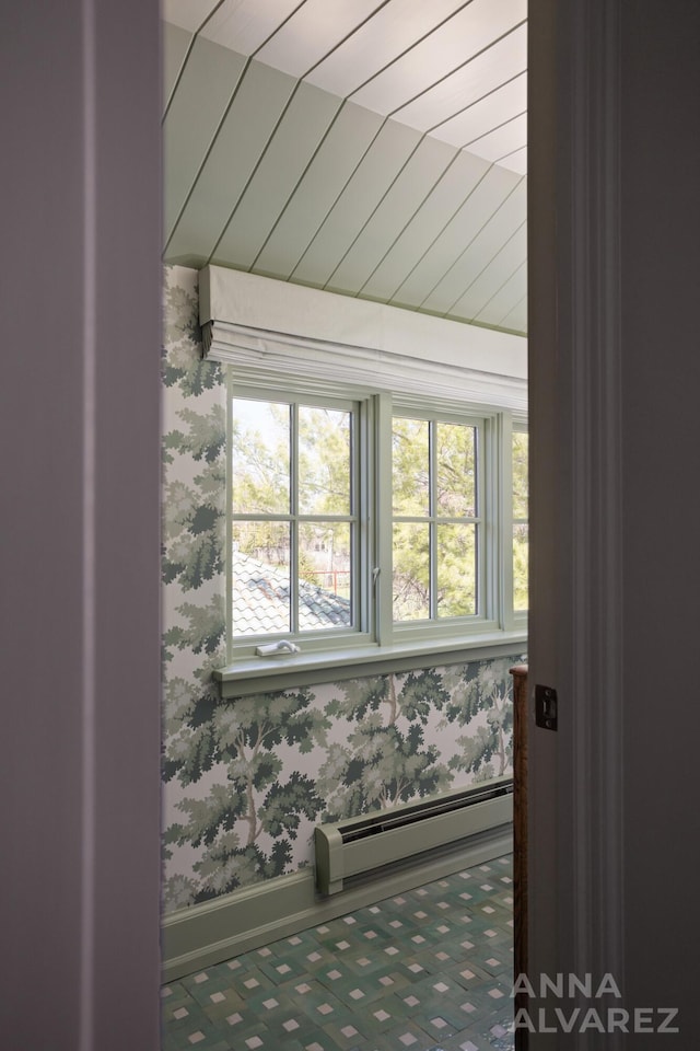 727 Plymouth Rd SE, East Grand Rapids, MI 49506 - detailed view of a baseboard heating unit and wallpapered walls