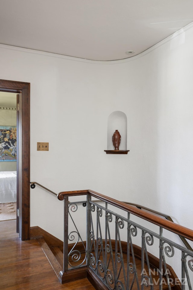 727 Plymouth Rd SE, East Grand Rapids, MI 49506 - staircase with wood finished floors and ornamental molding
