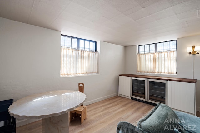 727 Plymouth Rd SE, East Grand Rapids, MI 49506 - bar area with plenty of natural light and wood finished floors