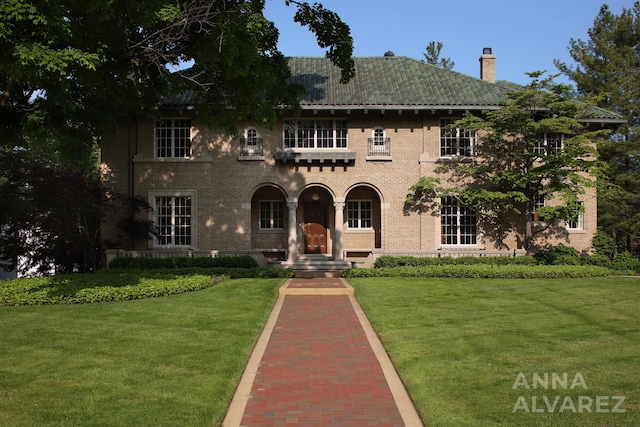 727 Plymouth Rd SE, East Grand Rapids, MI 49506 - view of front of property with a chimney, a front lawn, and brick siding