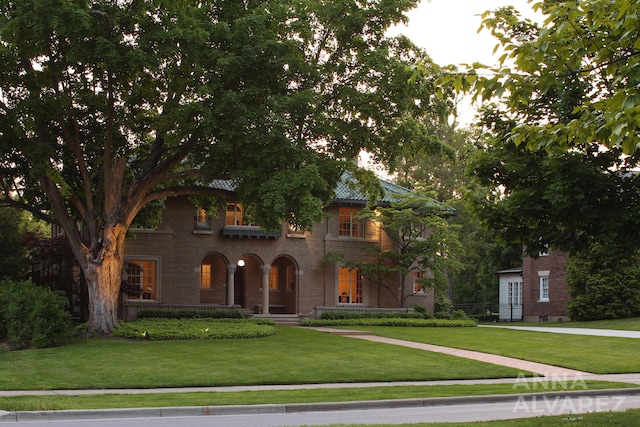 727 Plymouth Rd SE, East Grand Rapids, MI 49506 - mediterranean / spanish home with a front lawn and brick siding