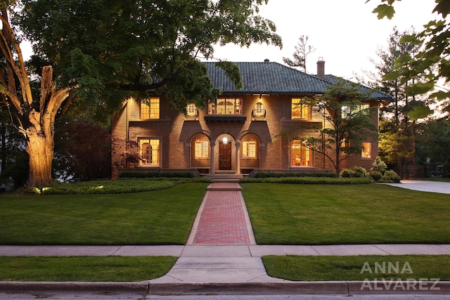 727 Plymouth Rd SE, East Grand Rapids, MI 49506 - view of front of house featuring a chimney and a front yard