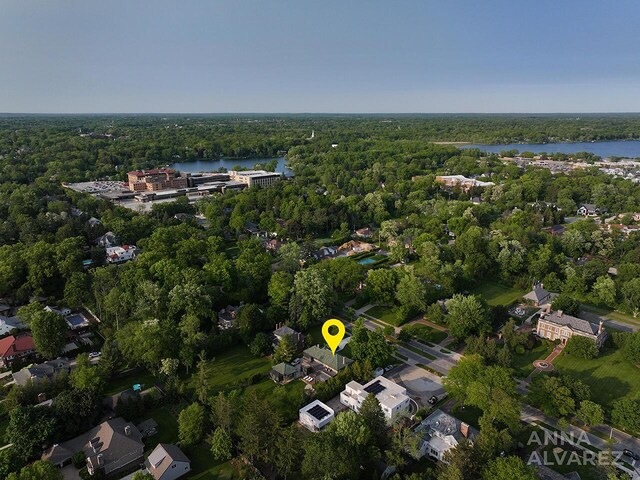 727 Plymouth Rd SE, East Grand Rapids, MI 49506 - aerial overview of property's location featuring a heavily wooded area