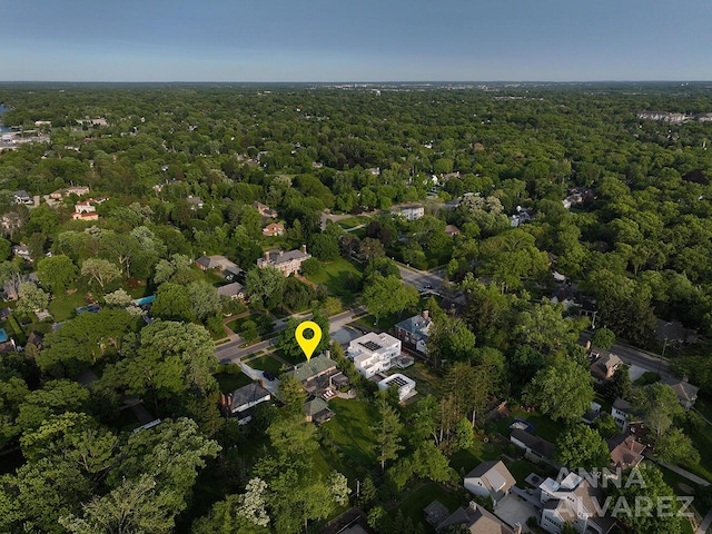 727 Plymouth Rd SE, East Grand Rapids, MI 49506 - aerial view of property and surrounding area featuring a forest