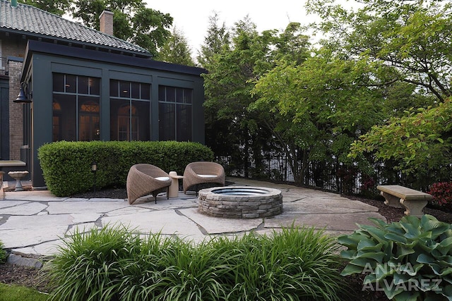 727 Plymouth Rd SE, East Grand Rapids, MI 49506 - view of patio featuring an outdoor fire pit