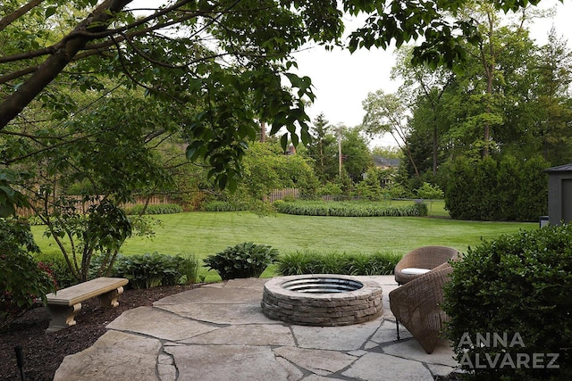 727 Plymouth Rd SE, East Grand Rapids, MI 49506 - view of patio / terrace with an outdoor fire pit