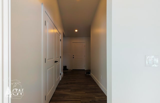 hallway featuring recessed lighting, dark wood finished floors, and baseboards