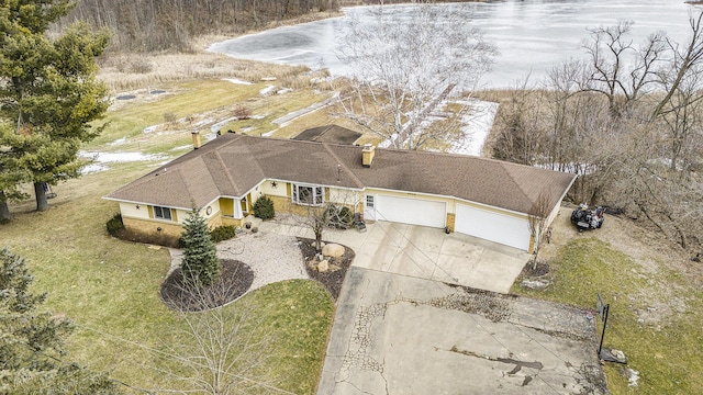 birds eye view of property featuring a water view