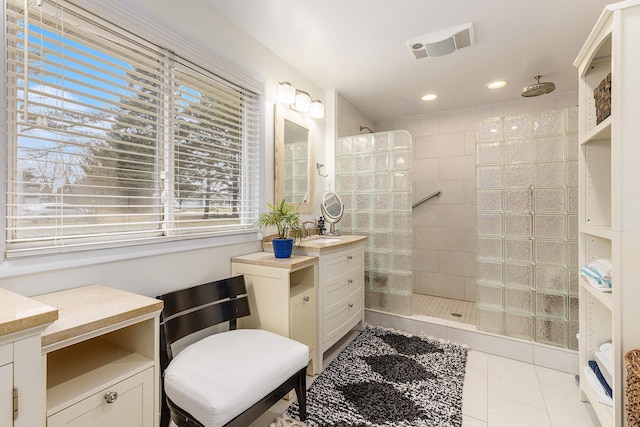 6665 E Lake St, Sand Lake, MI 49343 - bathroom featuring vanity, visible vents, recessed lighting, tile patterned floors, and a walk in shower