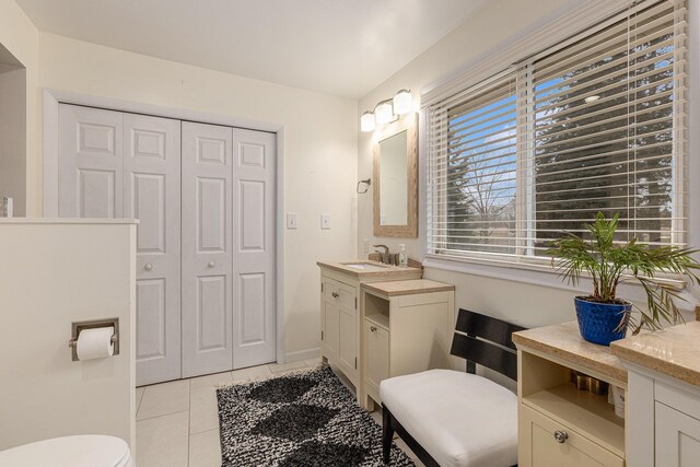 6665 E Lake St, Sand Lake, MI 49343 - bathroom with toilet, tile patterned flooring, a closet, and vanity
