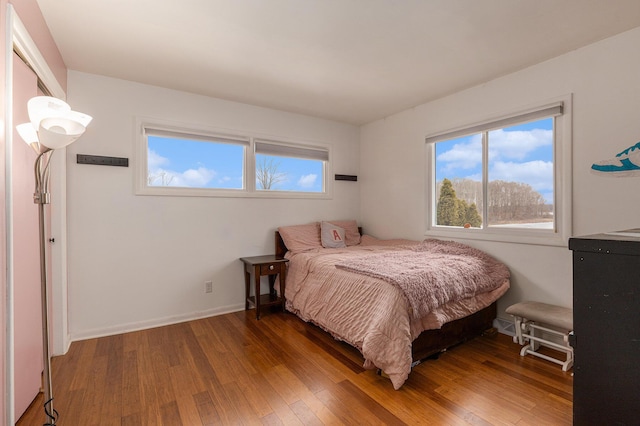 6665 E Lake St, Sand Lake, MI 49343 - bedroom featuring baseboards and wood finished floors