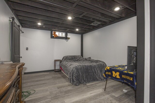 6665 E Lake St, Sand Lake, MI 49343 - bedroom featuring wood finished floors