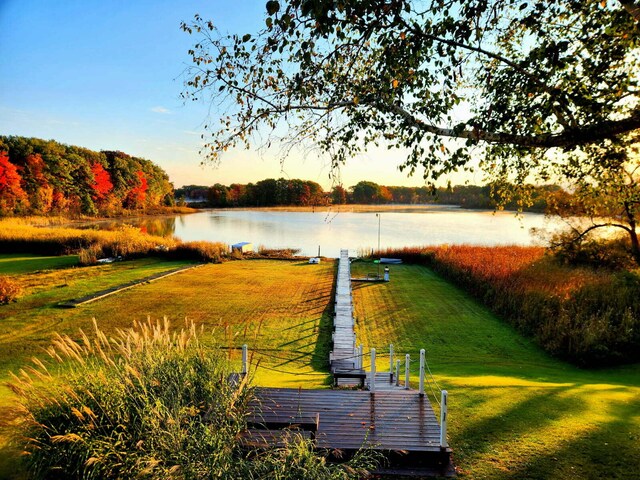 6665 E Lake St, Sand Lake, MI 49343 - view of community featuring a water view, a lawn, and a boat dock