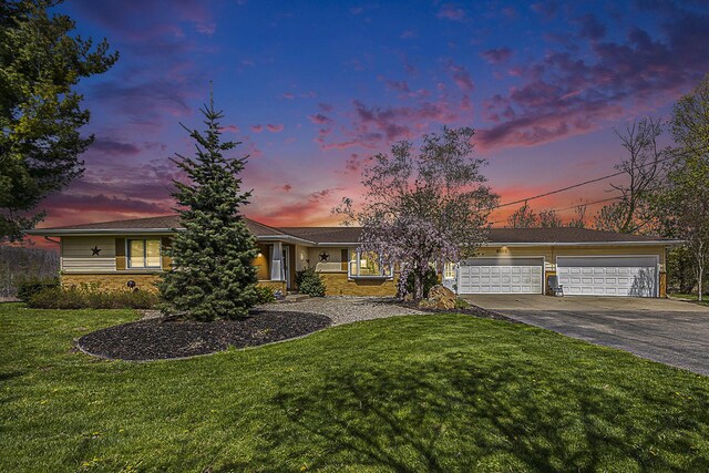 6665 E Lake St, Sand Lake, MI 49343 - view of front facade featuring an attached garage, a front lawn, and driveway