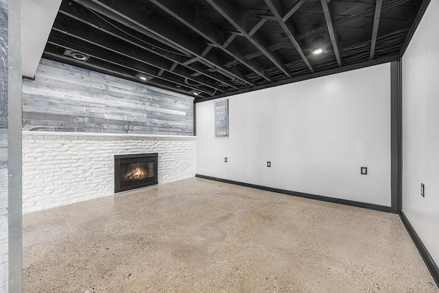6665 E Lake St, Sand Lake, MI 49343 - finished below grade area with baseboards and a glass covered fireplace