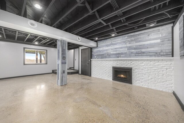 6665 E Lake St, Sand Lake, MI 49343 - basement with a large fireplace and baseboards