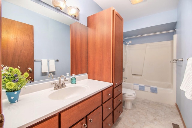 bathroom with toilet, tile patterned floors, bathing tub / shower combination, and vanity