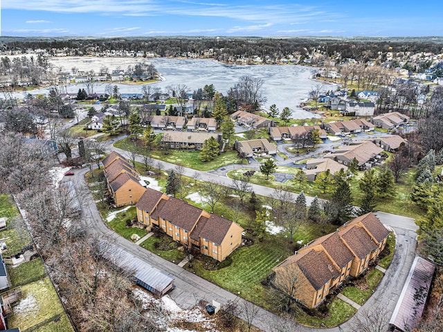 birds eye view of property featuring a water view and a residential view