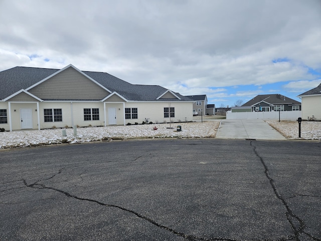 view of front of property featuring fence