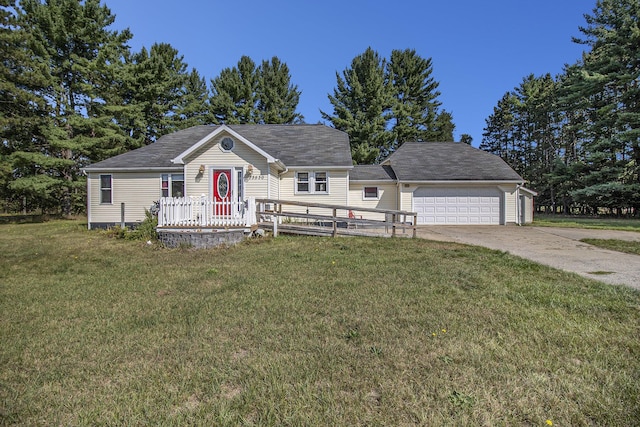 view of front of house featuring a garage, a front lawn, and concrete driveway