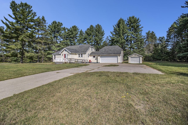 view of front of house featuring a garage, a front yard, and concrete driveway