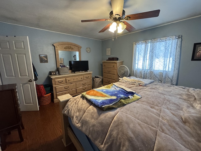 bedroom featuring a ceiling fan and dark wood-style flooring