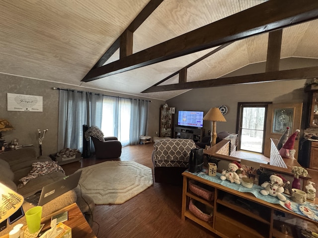 living area with vaulted ceiling with beams and wood finished floors