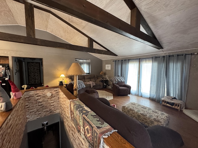 living room with high vaulted ceiling and beam ceiling