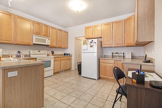 kitchen featuring white appliances, light tile patterned floors, light countertops, light brown cabinets, and a sink