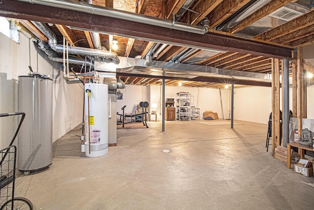 unfinished basement with water heater and visible vents