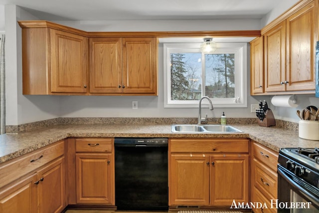 kitchen with brown cabinets, light countertops, a sink, and black appliances