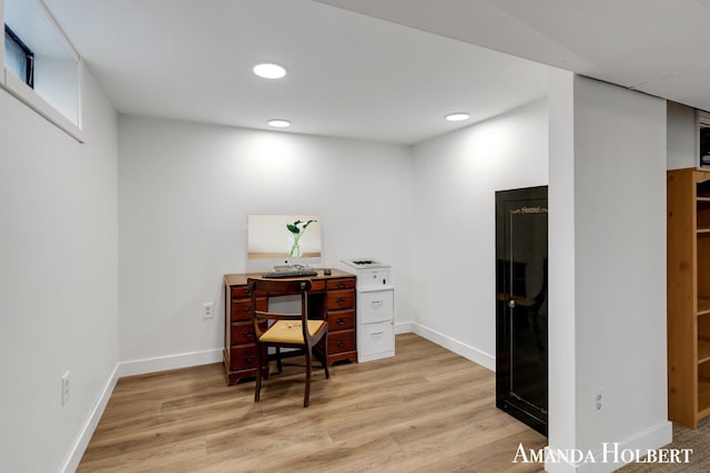 home office featuring baseboards, recessed lighting, and light wood-style floors