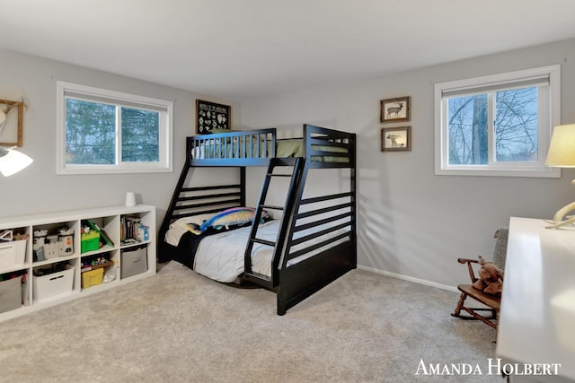 carpeted bedroom featuring baseboards