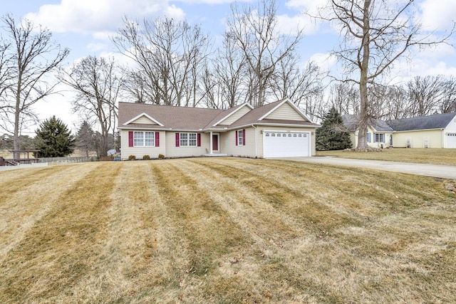 ranch-style home featuring driveway, a garage, and a front lawn