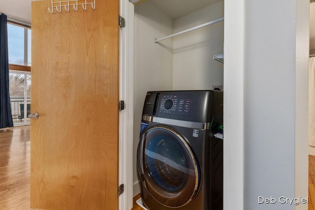washroom featuring laundry area and washer / clothes dryer