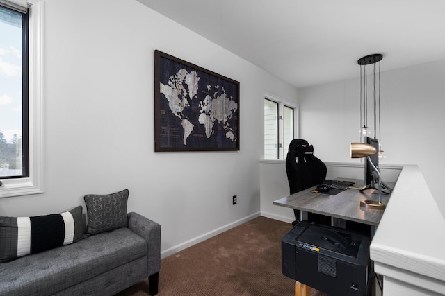 home office featuring baseboards and dark carpet