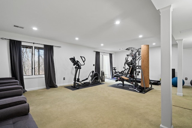 exercise area featuring carpet, visible vents, decorative columns, and recessed lighting