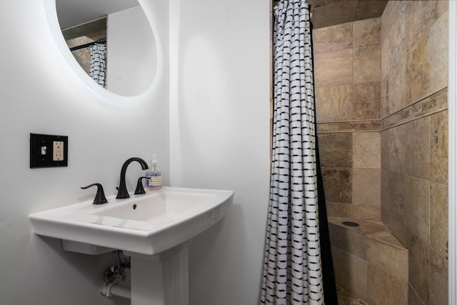 full bathroom with a tile shower