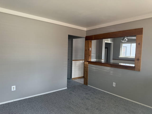 spare room with carpet flooring and baseboards